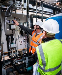 Renewable energy engineer inspects solar panel installation