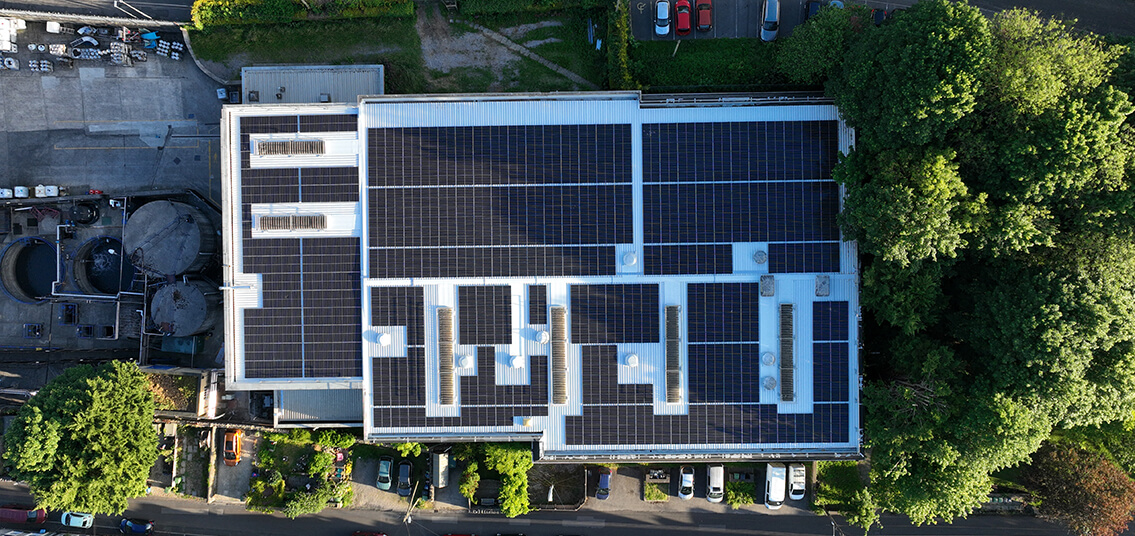 Solar panel system on trapezoidal roof of factory