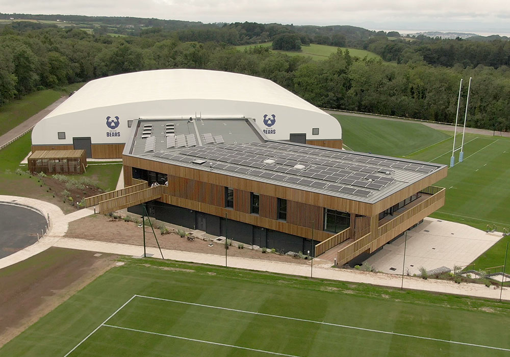 Solar PV Panels installed on the flat roof of rugby club